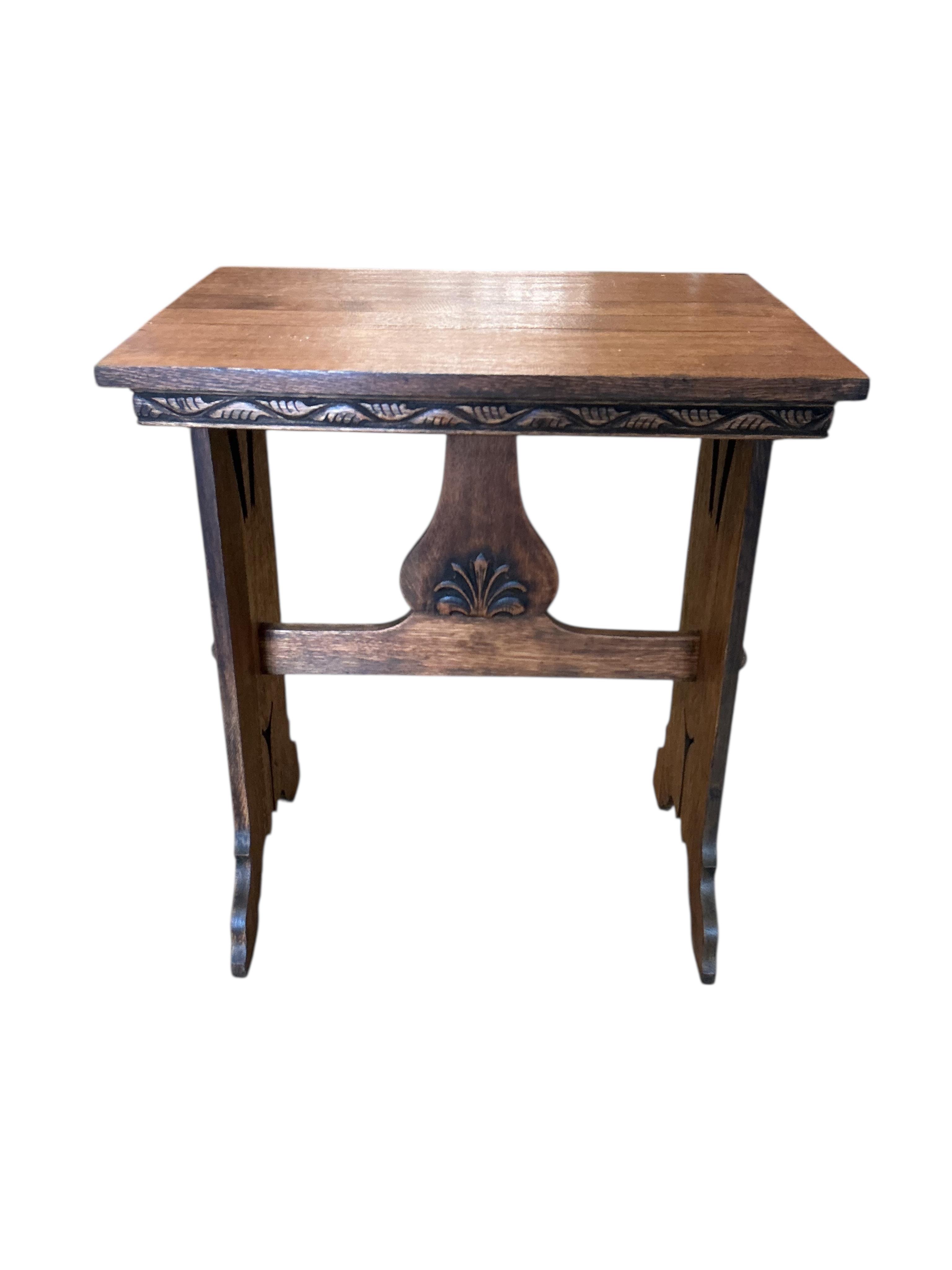 An Arts & Crafts style rectangular oak occasional table, width 63cm, depth 46cm, height 73cm